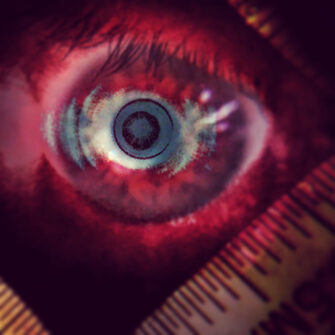 Eye with scale, red hue emphasis